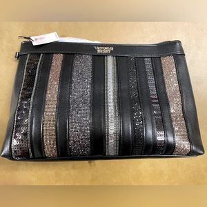 Victoria’s Secret NWT 🎉HP🎉 black and metallic stripe cosmetic bag. Zipper top